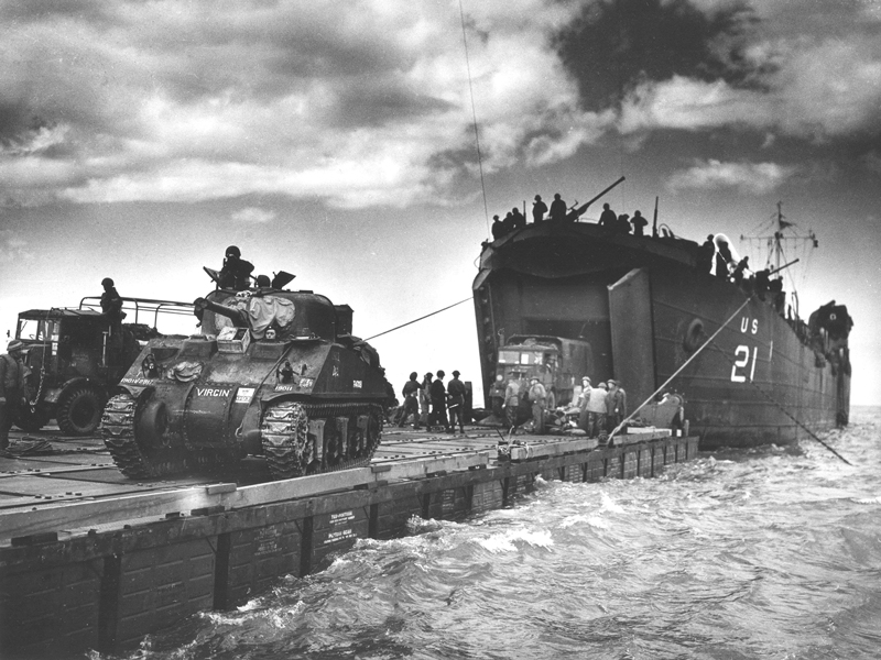 Tank Landing Ships (LST) deliver vehicles onto beach
